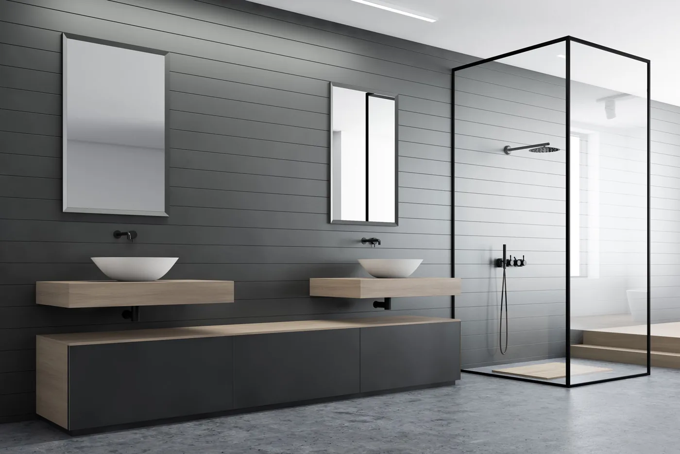 Charcoal tiled bathroom with twin timber vanities and a black framed walk-in shower