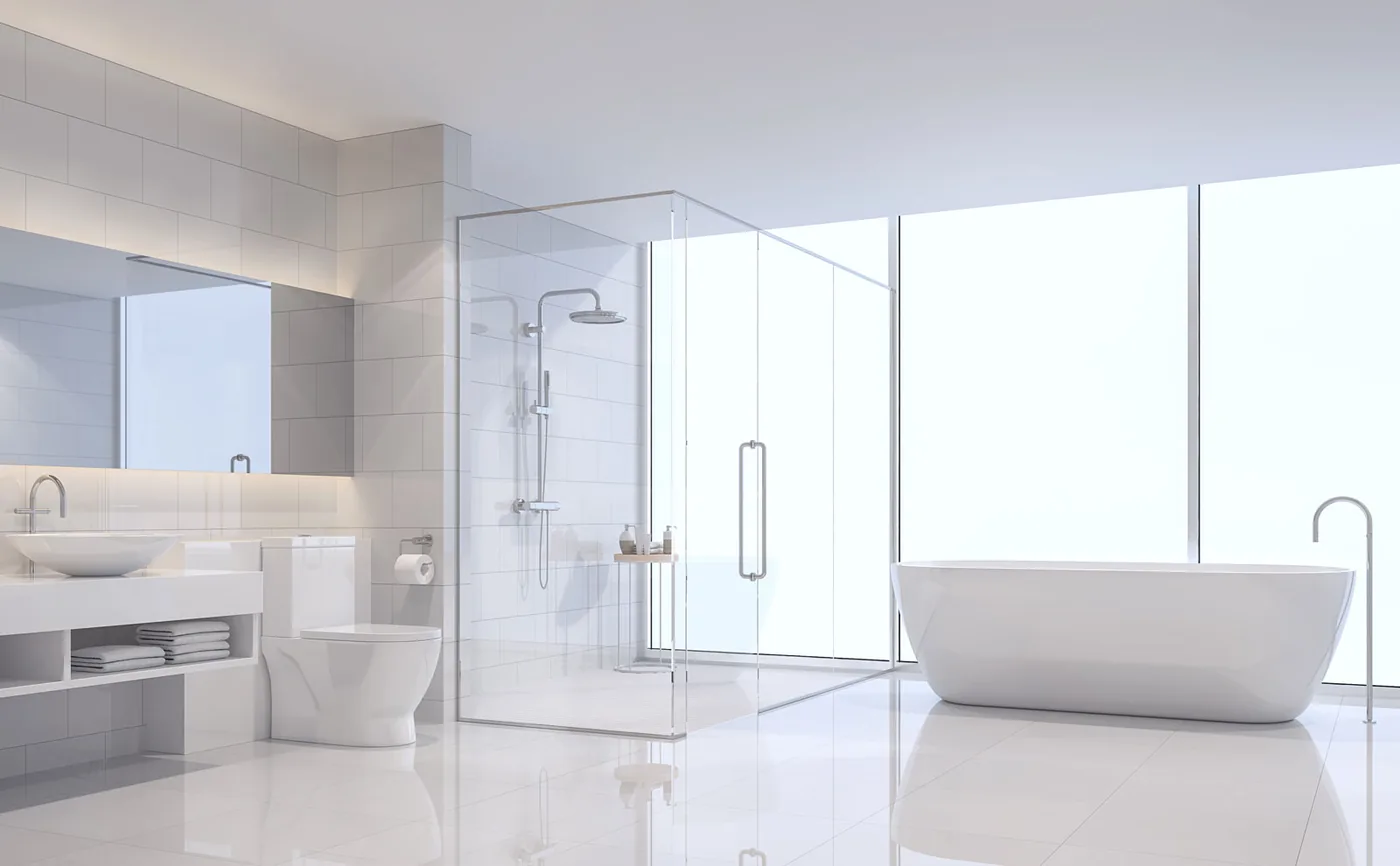 Bright white minimal bathroom with a glass shower screen and freestanding bath